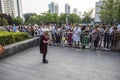 A 70-year-old grandmother sang Teresa TangÃ¢â¬â¢s song at Xuanwumen Square to attract a large number of people to watch Royalty Free Stock Photo